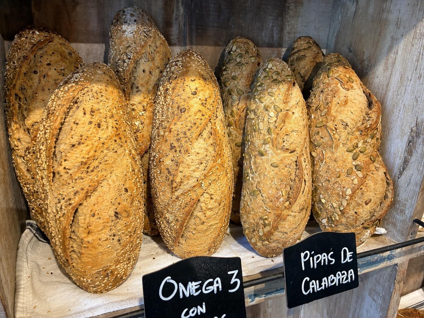 Freshly baked Omega-3 seeded artisan loaves at THE BAKERY BANÚS